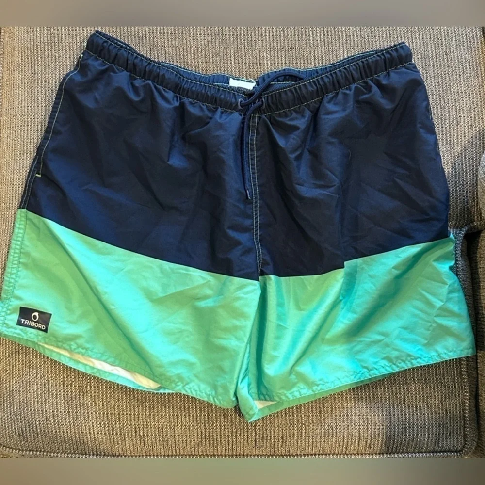 D09.9. Tribord men’s swim trunks color block navy blue/ green Sz 32 W